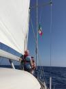 Raising the Italian flag as we enter territorial waters